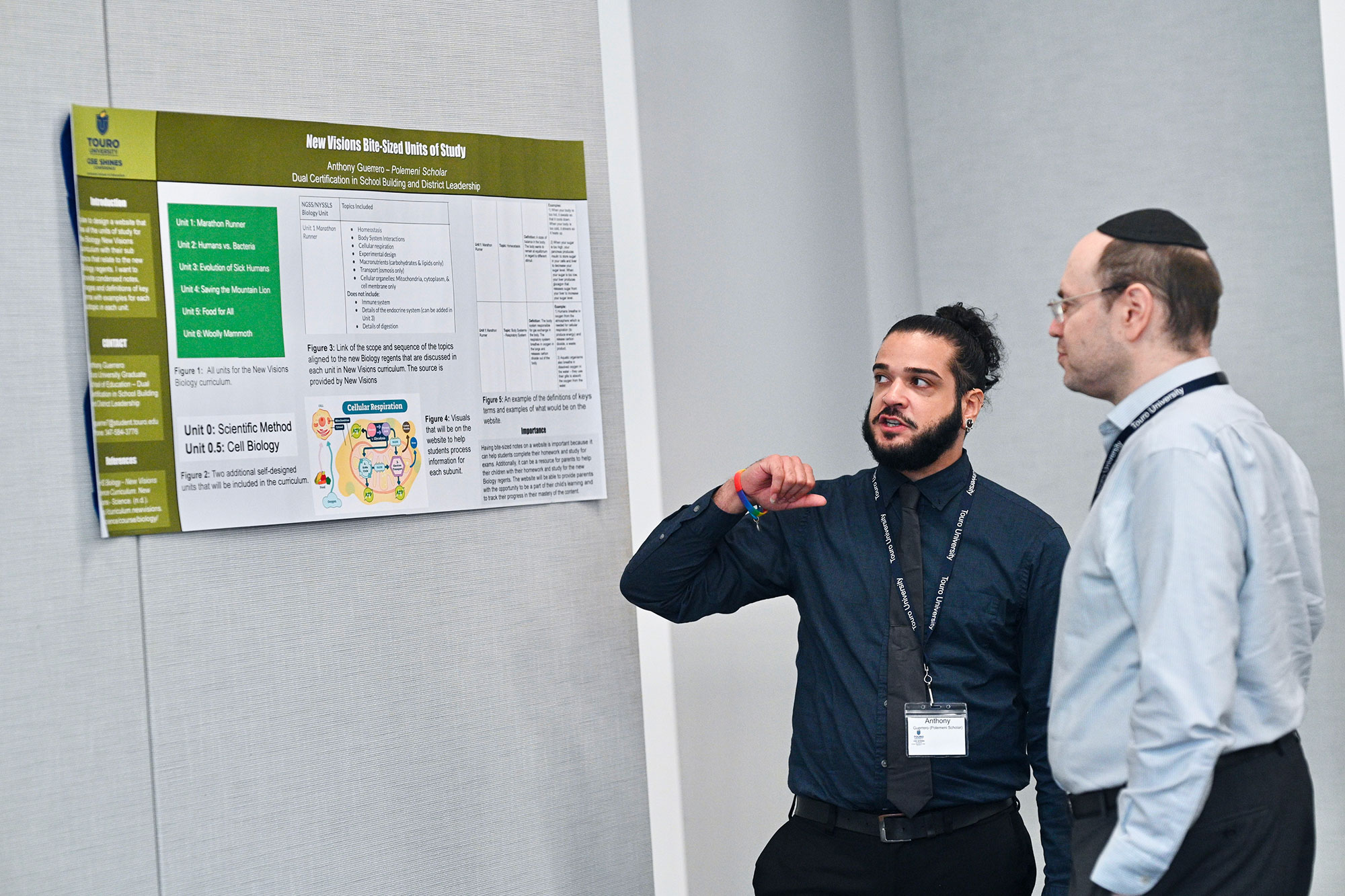 GSE student showing professor his research project